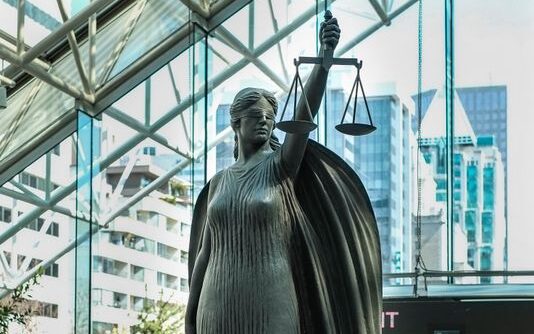 Statue of Justice located in The Great Hall at the Vancouver Law Courts.